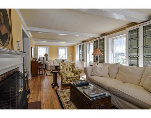 72 Main Street Framingham, MA 01702 - Photo 7 of 28 a living room with furniture and a fireplace