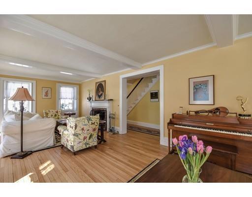 72 Main Street Framingham, MA 01702 - Photo 8 of 28 a living room with furniture and a chandelier