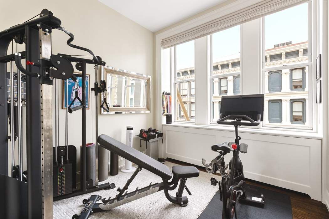 458 Broadway, Unit 6 Manhattan, NY 10013 - Photo 12 of 18 a view of a workspace with furniture and a window