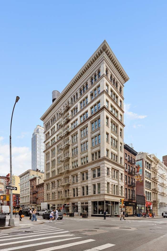 458 Broadway, Unit 6 Manhattan, NY 10013 - Photo 17 of 18 a view of a tall building next to a road