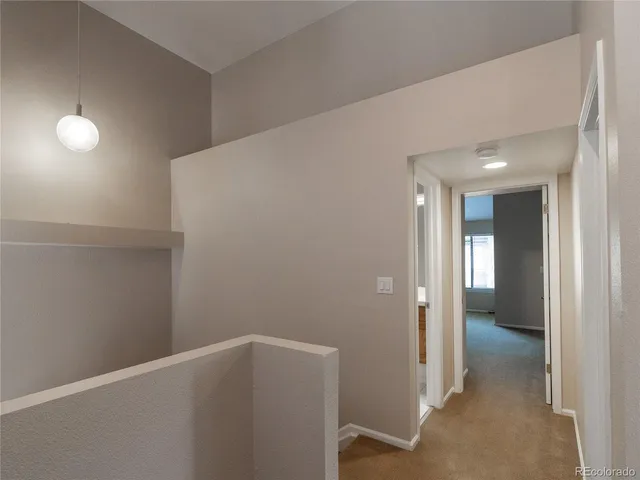 a bedroom with a large bed and a large window