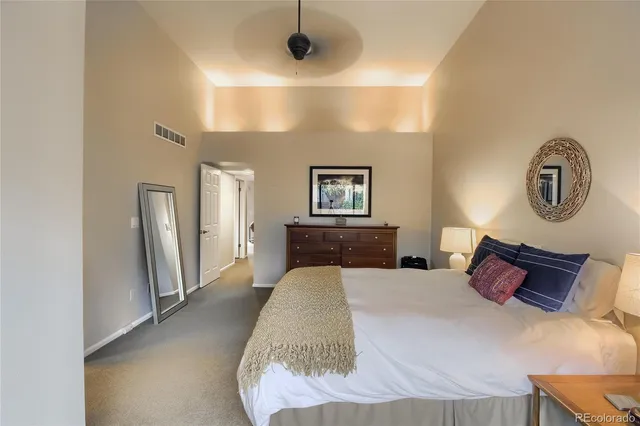 a bathroom with a tub double sink window and mirror