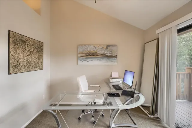 a view of balcony with wooden floor and outdoor seating