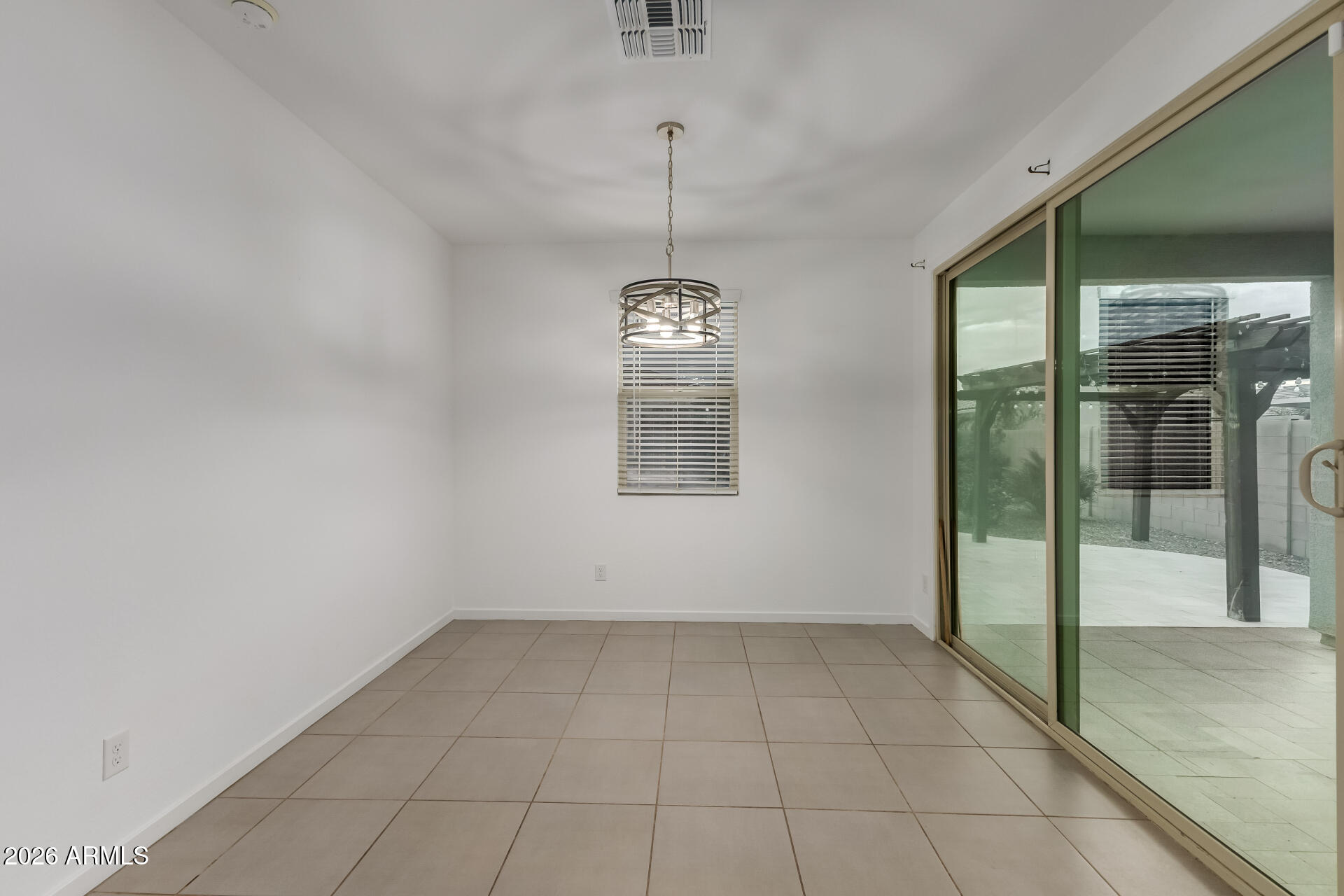 4337 East Italian Trotter Road San Tan Valley, AZ 85140 - Photo 11 of 35 a view of an empty room with glass door