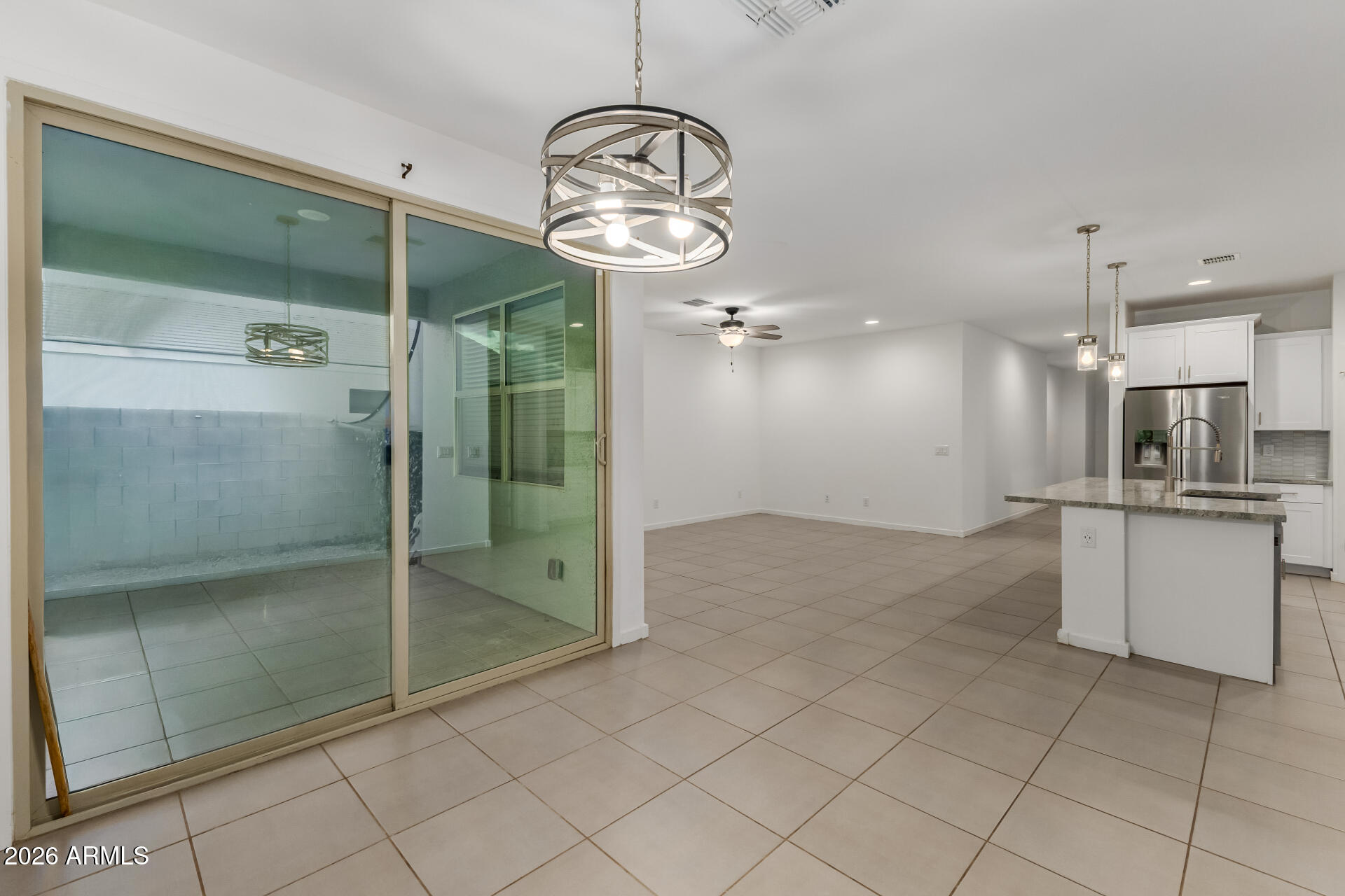 4337 East Italian Trotter Road San Tan Valley, AZ 85140 - Photo 12 of 35 a bathroom with a glass shower door and a sink