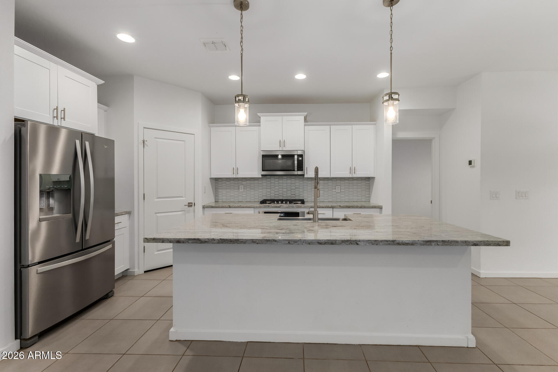 4337 East Italian Trotter Road San Tan Valley, AZ 85140 - Photo 13 of 35 a kitchen with stainless steel appliances granite countertop a refrigerator a sink a stove and a oven