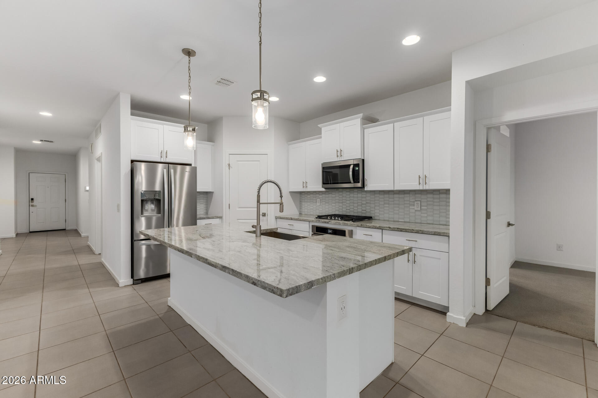 4337 East Italian Trotter Road San Tan Valley, AZ 85140 - Photo 14 of 35 a kitchen with stainless steel appliances granite countertop a refrigerator and a sink