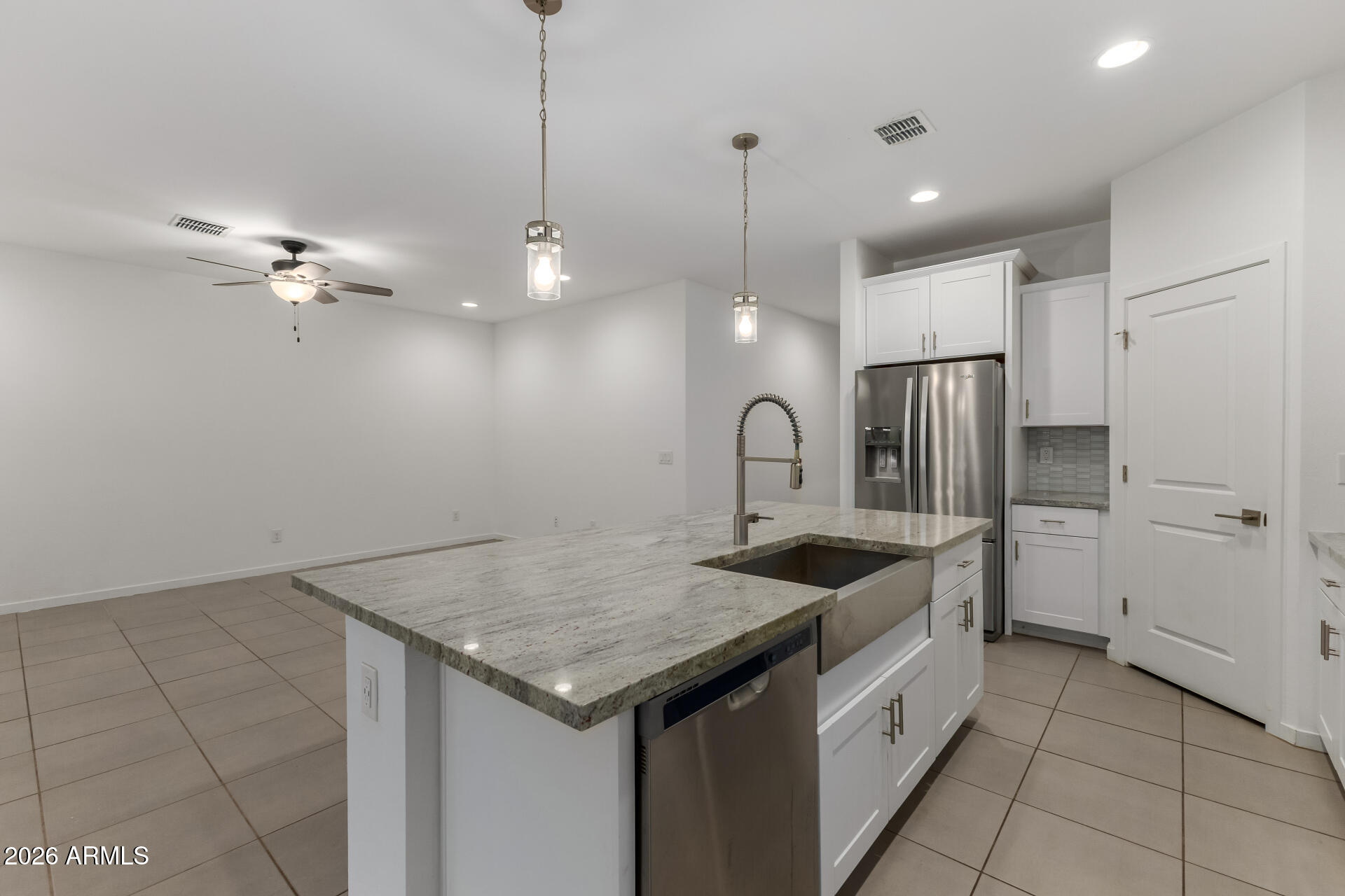 4337 East Italian Trotter Road San Tan Valley, AZ 85140 - Photo 15 of 35 a kitchen with a sink a counter space appliances and cabinets