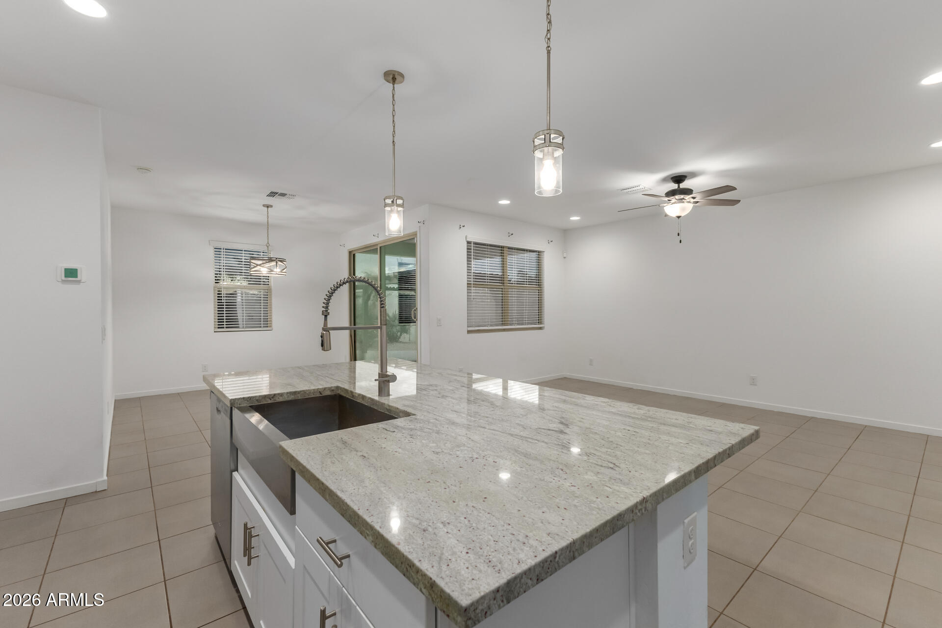 4337 East Italian Trotter Road San Tan Valley, AZ 85140 - Photo 17 of 35 a kitchen with a table and chairs in it