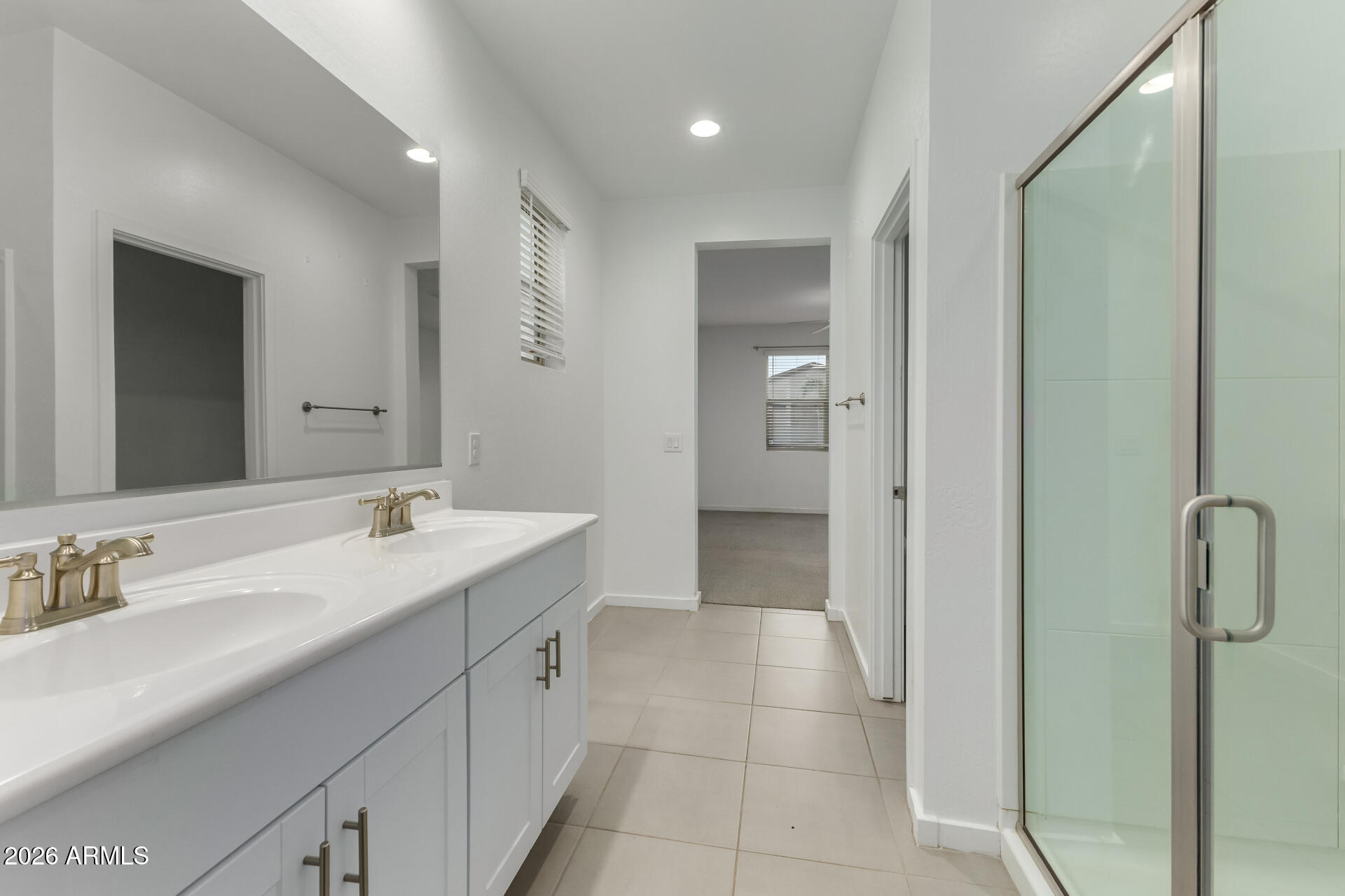 4337 East Italian Trotter Road San Tan Valley, AZ 85140 - Photo 21 of 35 a spacious bathroom with a granite countertop sink a mirror and a