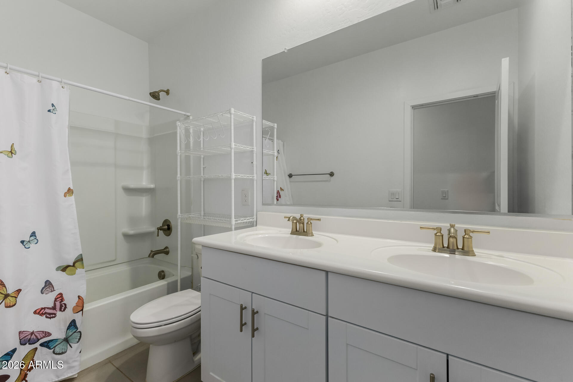 4337 East Italian Trotter Road San Tan Valley, AZ 85140 - Photo 25 of 35 a bathroom with a sink a toilet and shower