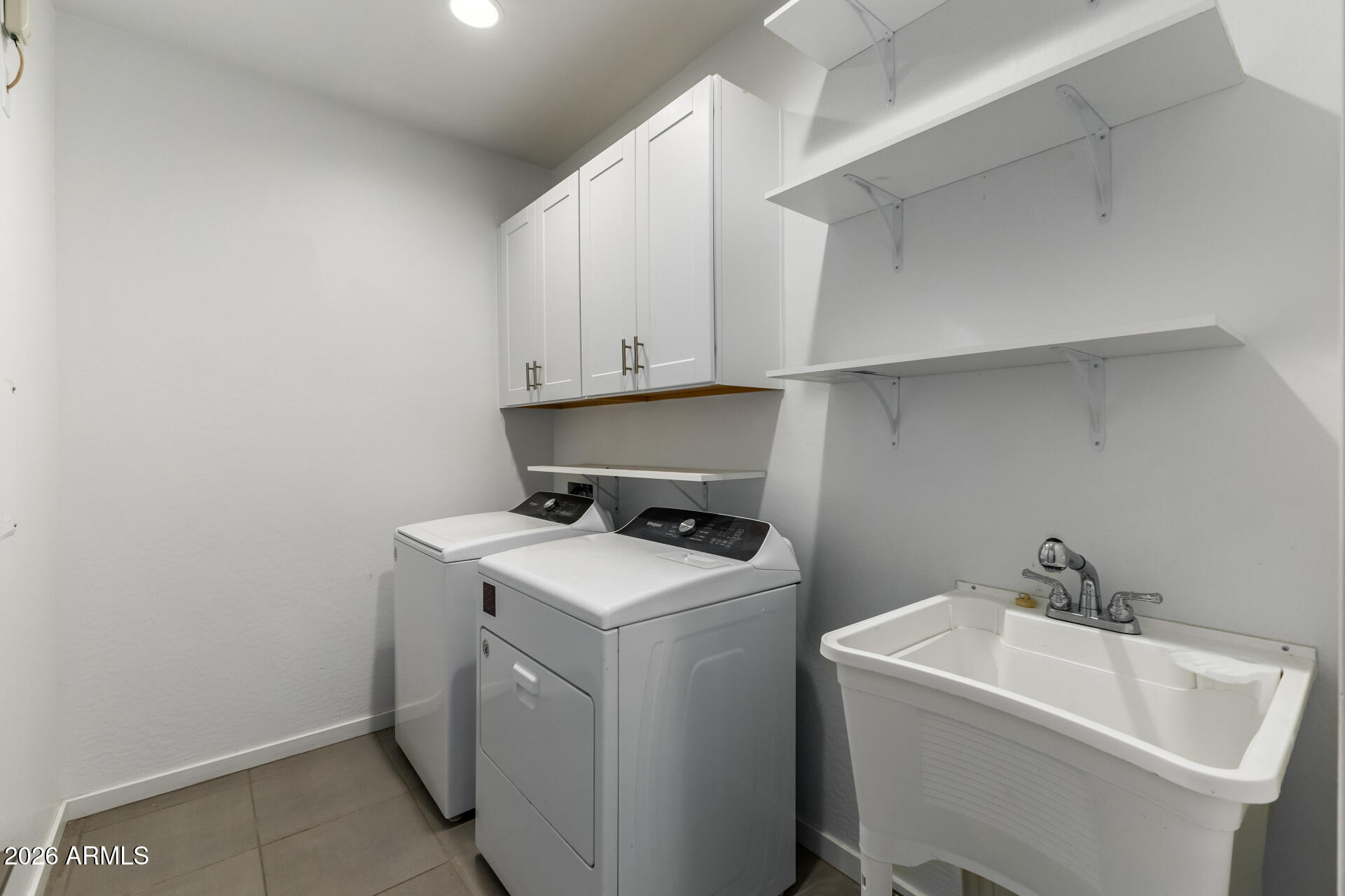 4337 East Italian Trotter Road San Tan Valley, AZ 85140 - Photo 28 of 35 a utility room with dryer and washer