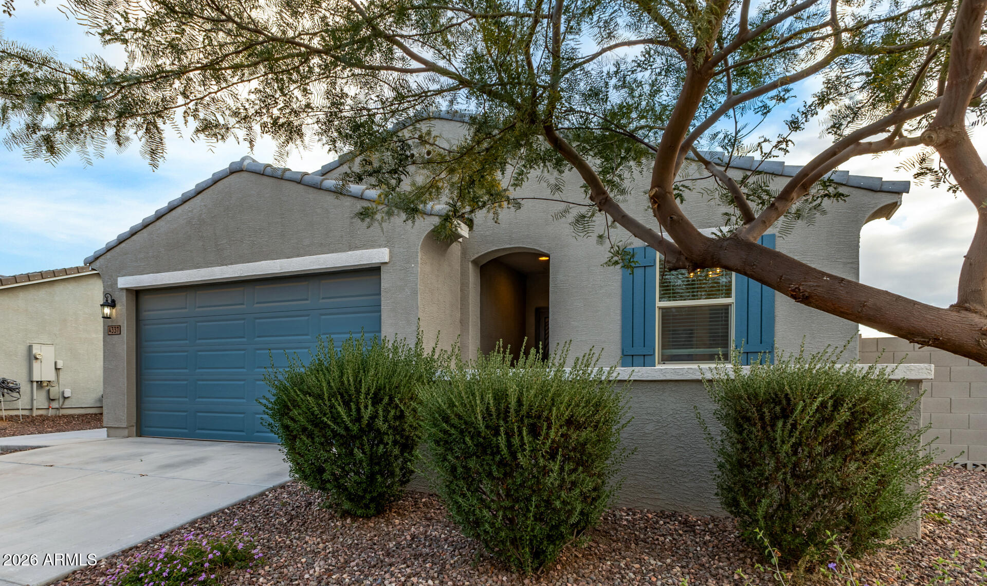 4337 East Italian Trotter Road San Tan Valley, AZ 85140 - Photo 5 of 35 a front view of a house with yard and trees