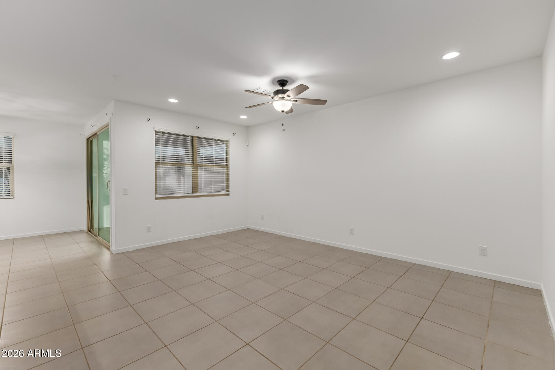 4337 East Italian Trotter Road San Tan Valley, AZ 85140 - Photo 8 of 35 an empty room with fan and windows