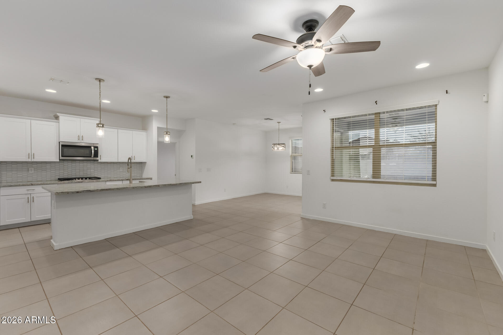 4337 East Italian Trotter Road San Tan Valley, AZ 85140 - Photo 9 of 35 a view of an empty room and kitchen view