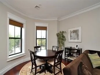 a view of a dining room with furniture and window