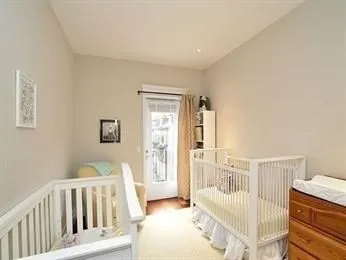 a bedroom with furniture and wooden floor