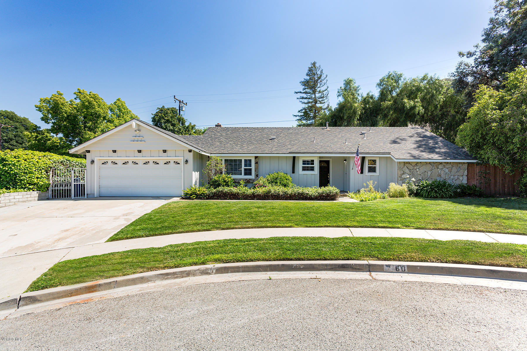 60 Marvin Court Simi Valley, CA 93065 - Photo 1 of 24 a front view of a house with a yard and potted plants