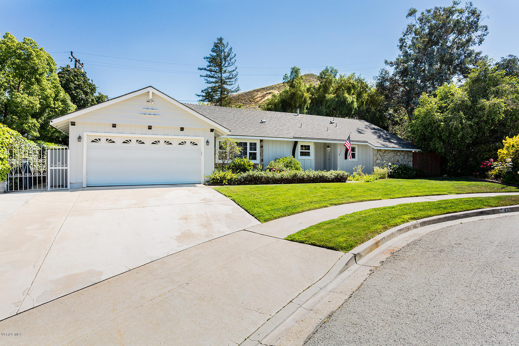 60 Marvin Court Simi Valley, CA 93065 - Photo 2 of 24 a front view of a house with a yard and garage