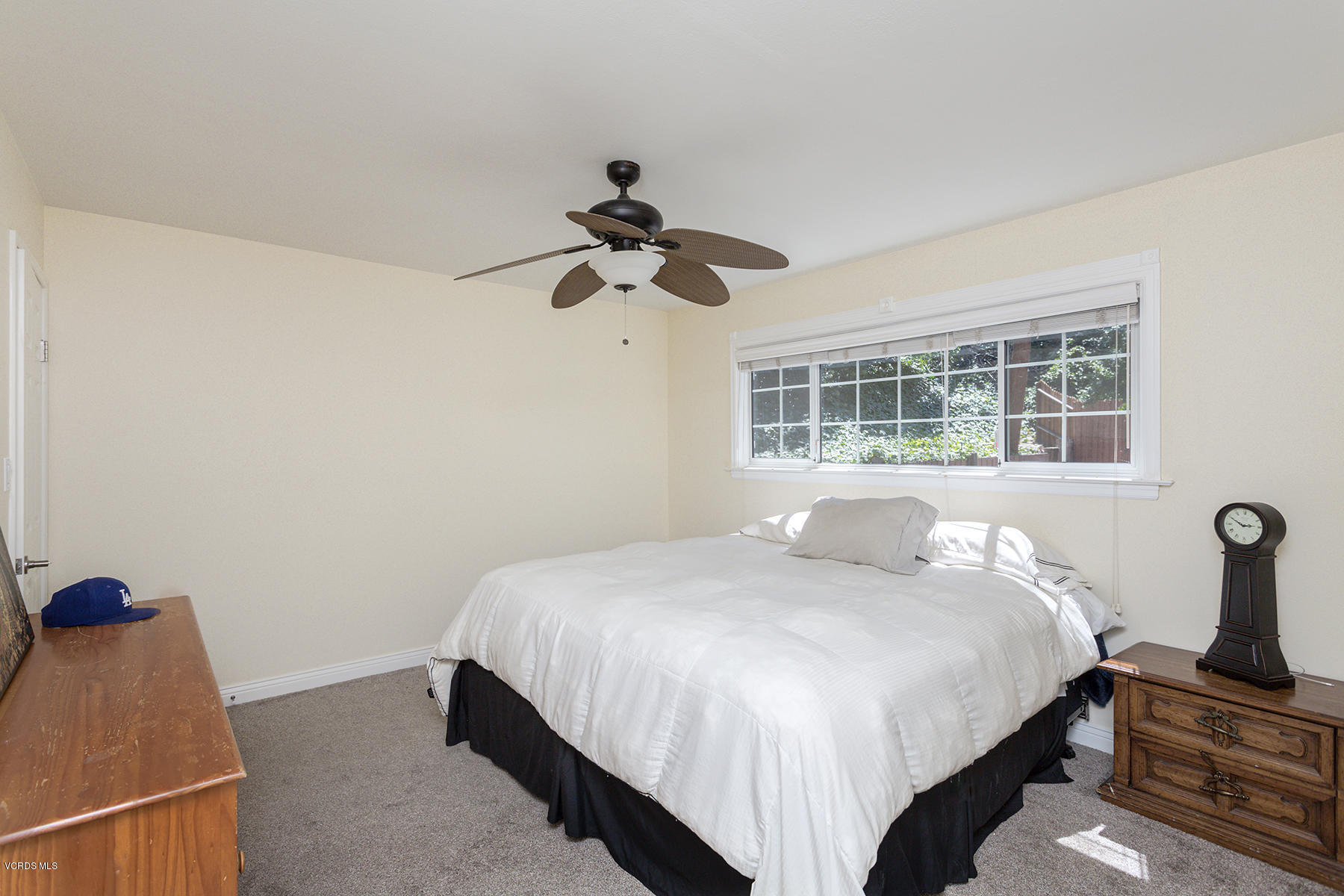 60 Marvin Court Simi Valley, CA 93065 - Photo 11 of 24 a bedroom with a bed and a chandelier