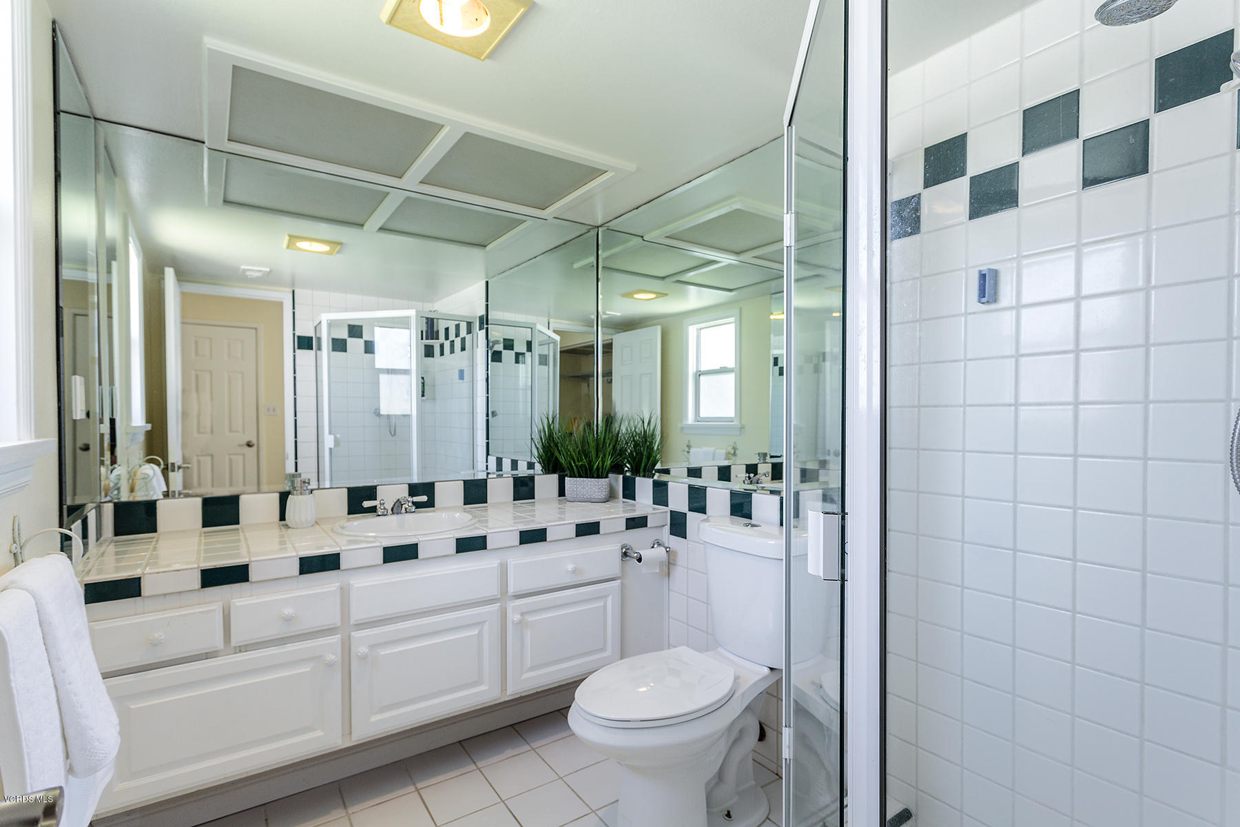 60 Marvin Court Simi Valley, CA 93065 - Photo 13 of 24 a bathroom with a double vanity sink toilet and shower