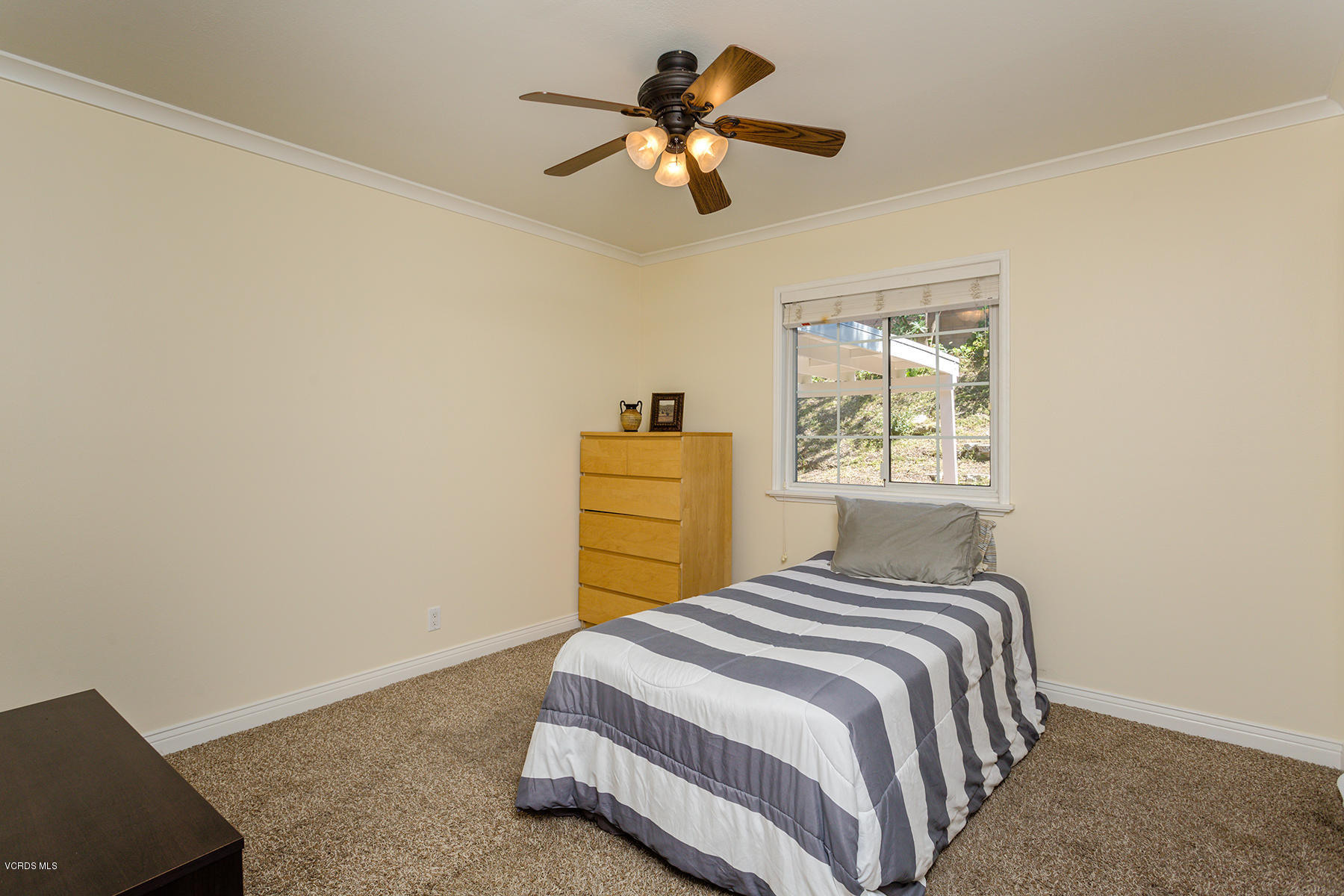 60 Marvin Court Simi Valley, CA 93065 - Photo 15 of 24 a bedroom with a bed and a chandelier