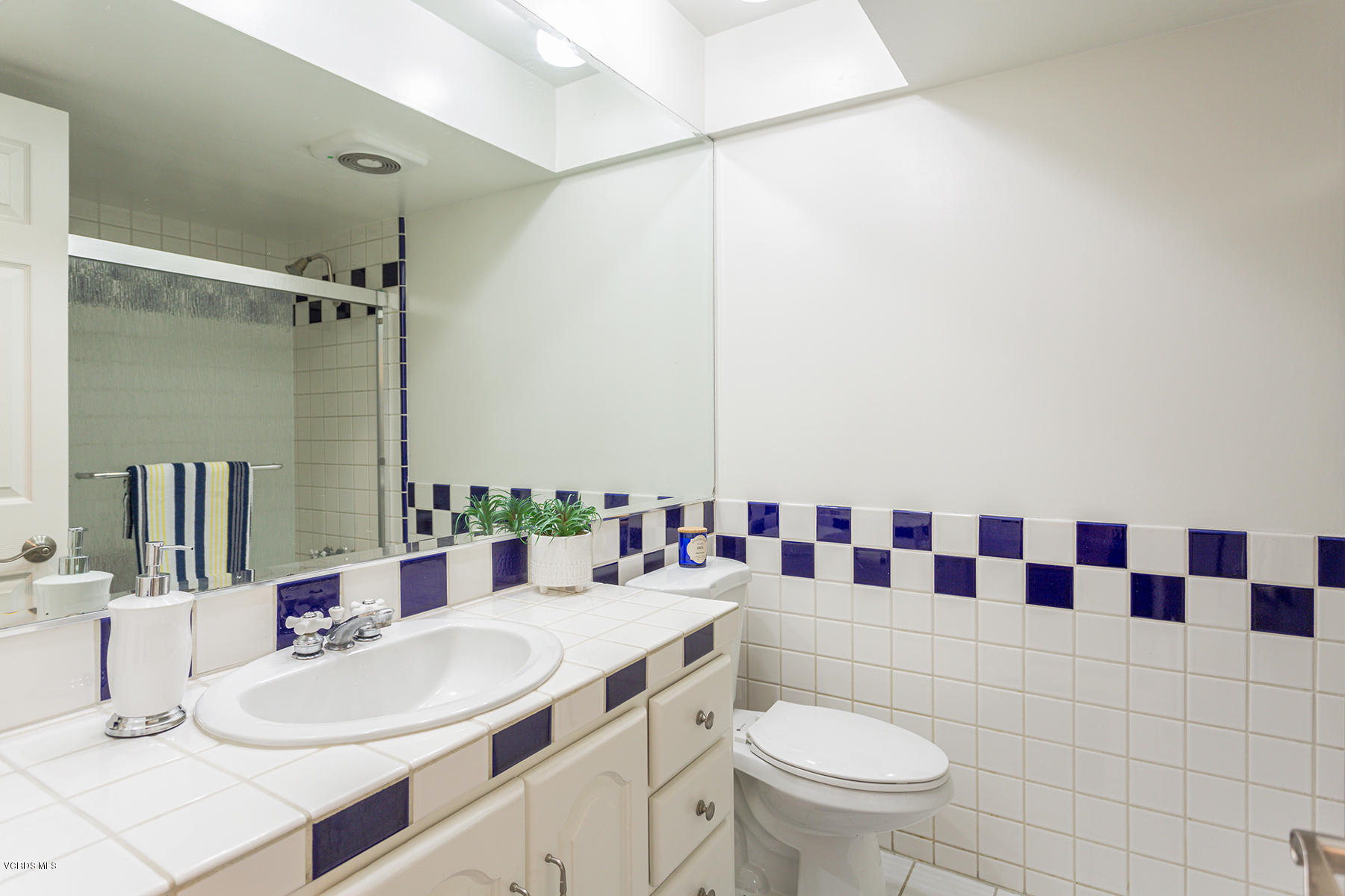 60 Marvin Court Simi Valley, CA 93065 - Photo 16 of 24 a bathroom with a sink and a mirror