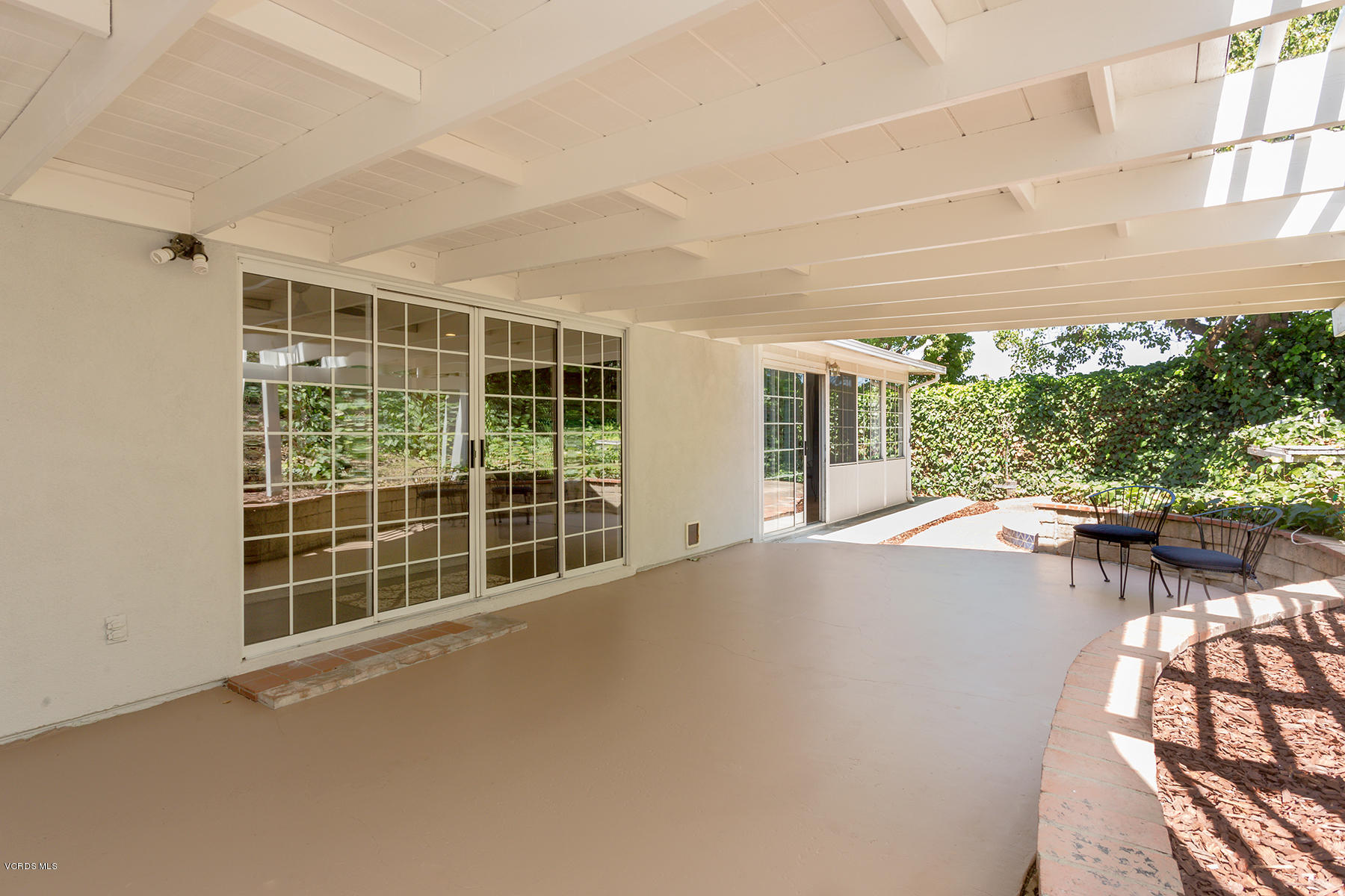60 Marvin Court Simi Valley, CA 93065 - Photo 20 of 24 a view of backyard with large windows and plants