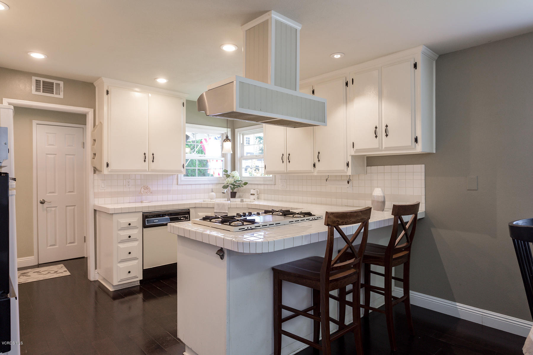 60 Marvin Court Simi Valley, CA 93065 - Photo 8 of 24 a kitchen with a stove a sink and a refrigerator