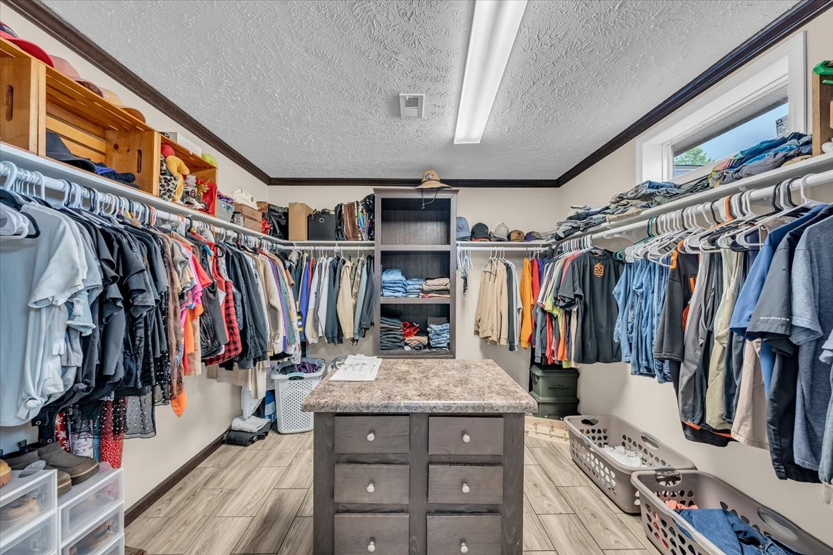 195 Roddy Springs Road Coalmont, TN 37313 - Photo 23 of 44 a view of walk in closet with clothes