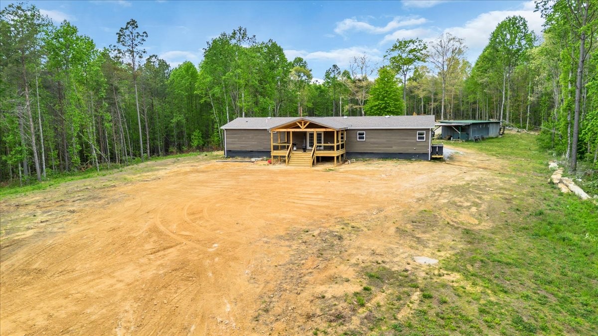 195 Roddy Springs Road Coalmont, TN 37313 - Photo 26 of 44 a house with trees in the background