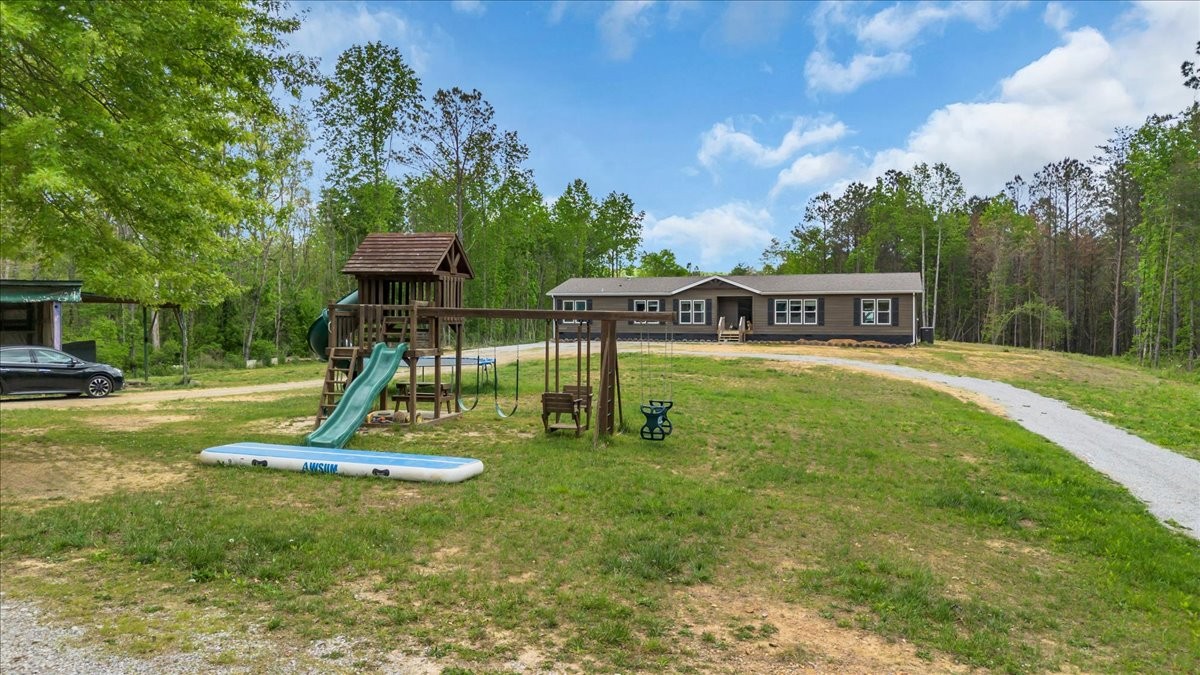 195 Roddy Springs Road Coalmont, TN 37313 - Photo 37 of 44 a view of a house with a swimming pool