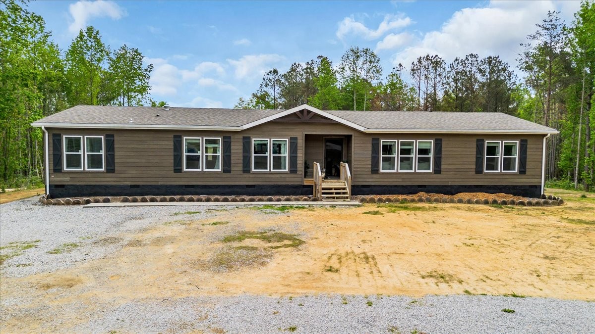 195 Roddy Springs Road Coalmont, TN 37313 - Photo 41 of 44 a front view of a house with a yard