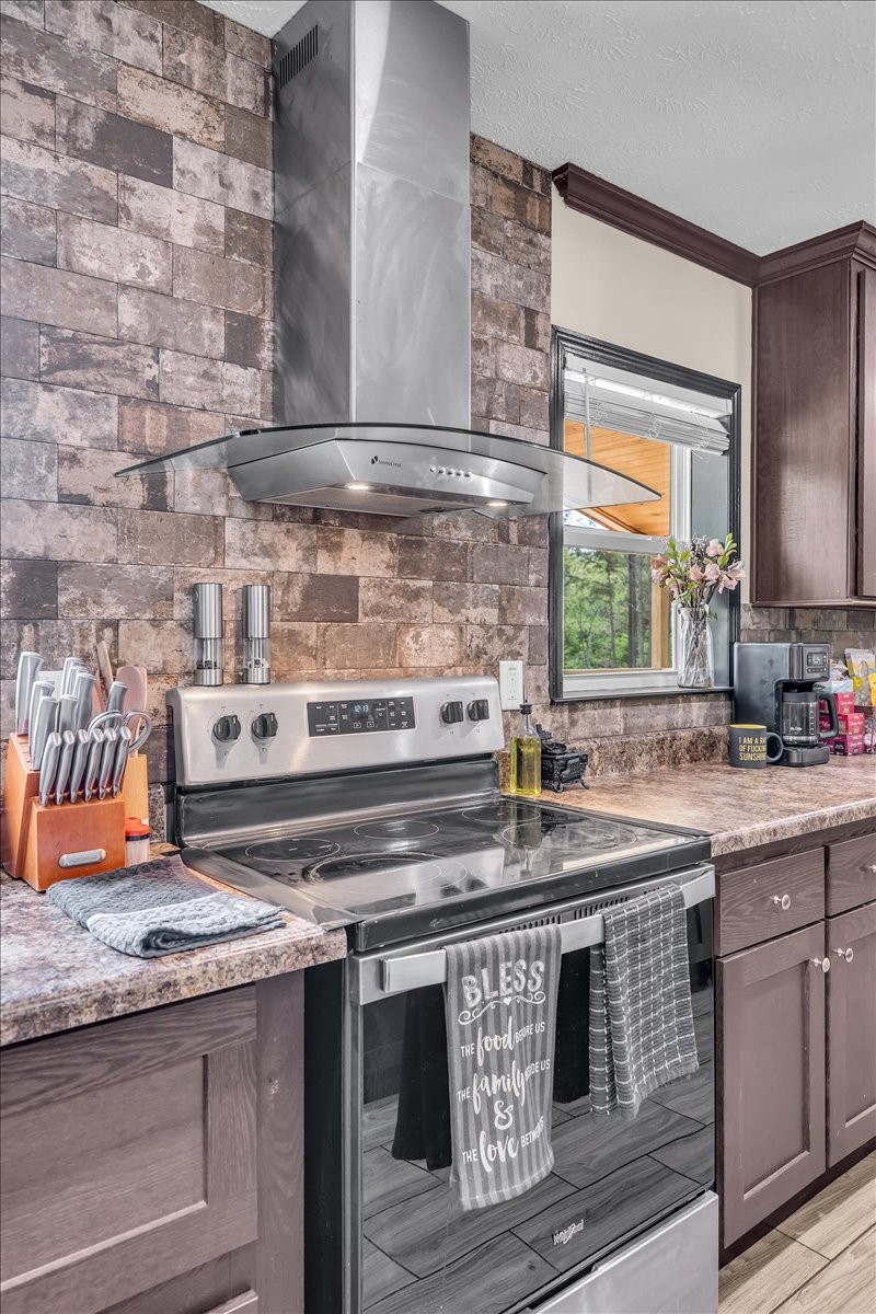 195 Roddy Springs Road Coalmont, TN 37313 - Photo 10 of 44 a kitchen with stainless steel appliances granite countertop a stove a sink and a microwave