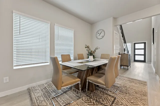 a view of a dining room with furniture and window