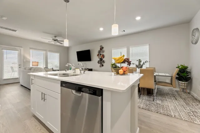 a view of a kitchen area kitchen island dining table and chairs