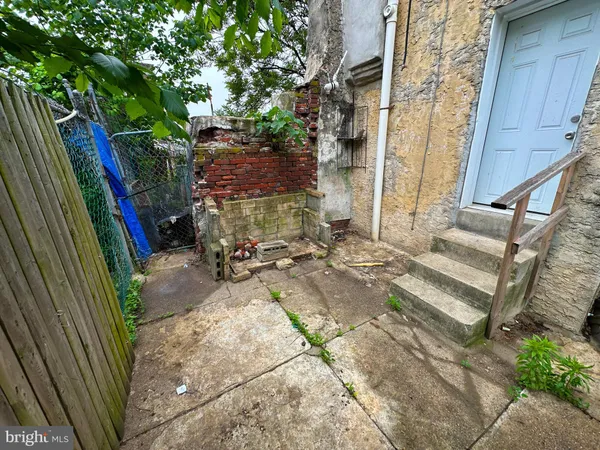 a view of backyard with a table and chair