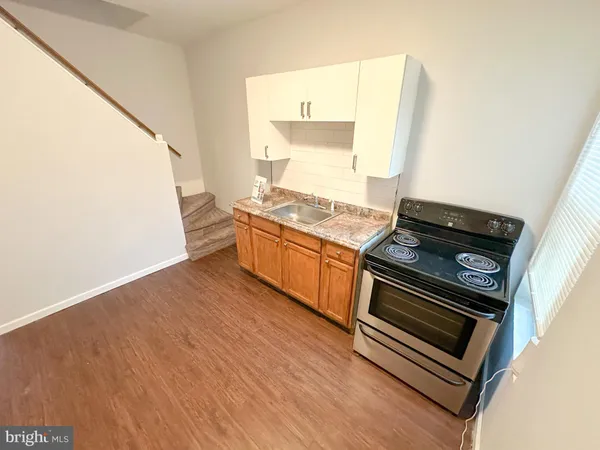 a kitchen with a stove and a microwave