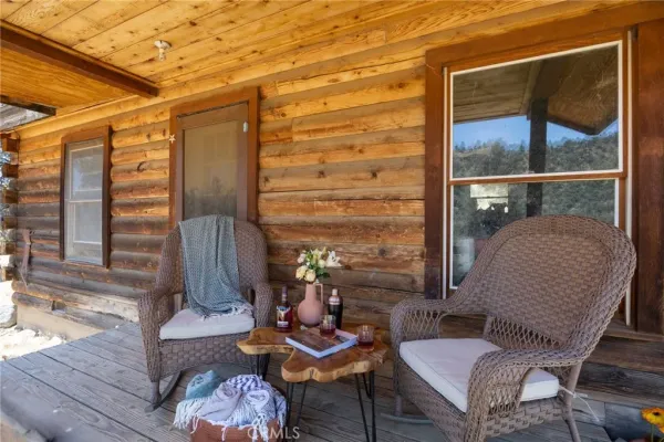 a outdoor living space with furniture and a rug