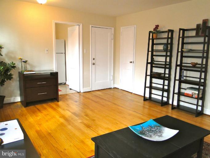 8722 Manchester Road, Unit 7 Silver Spring, MD 20901 - Photo 6 of 16 a view of a livingroom with furniture and wooden floor