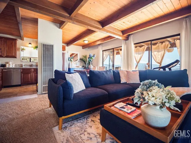 a bath room with a granite countertop toilet and a bathtub