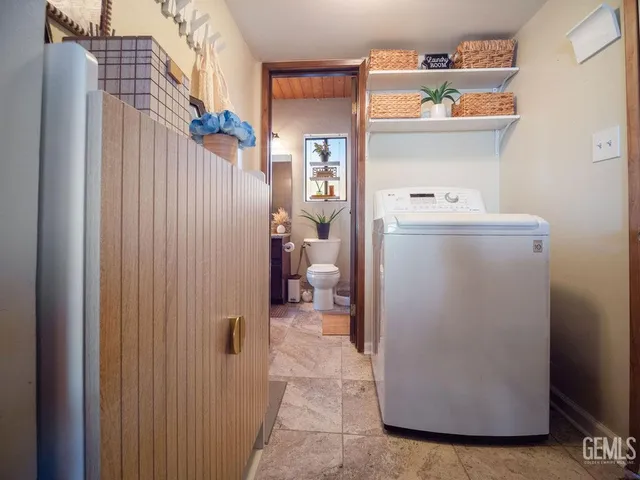 a spacious bedroom with a bed and a couch