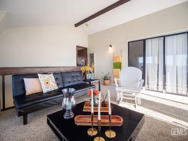 a bathroom with a granite countertop sink and a toilet