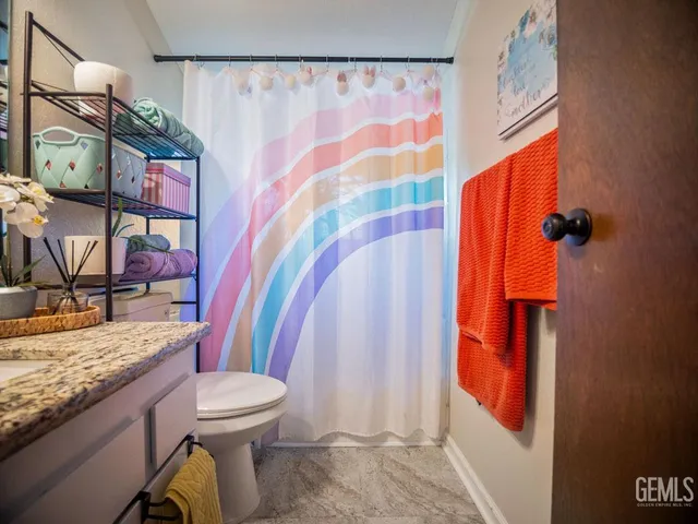 a view of living room with furniture and window