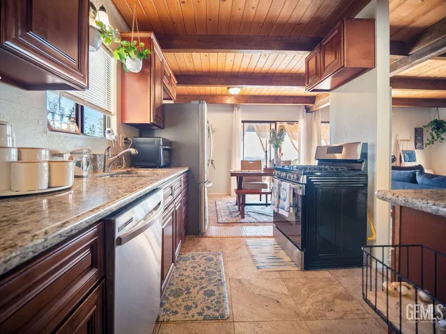 a view of a patio with table and chairs