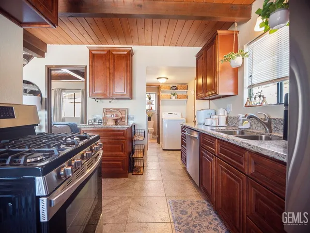 a living room with furniture a rug and a chandelier