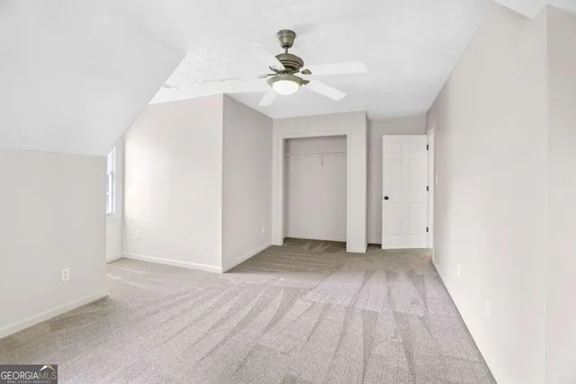 a view of balcony with wooden floor and fence