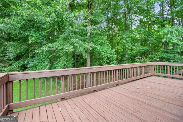 an aerial view of a houses with a yard