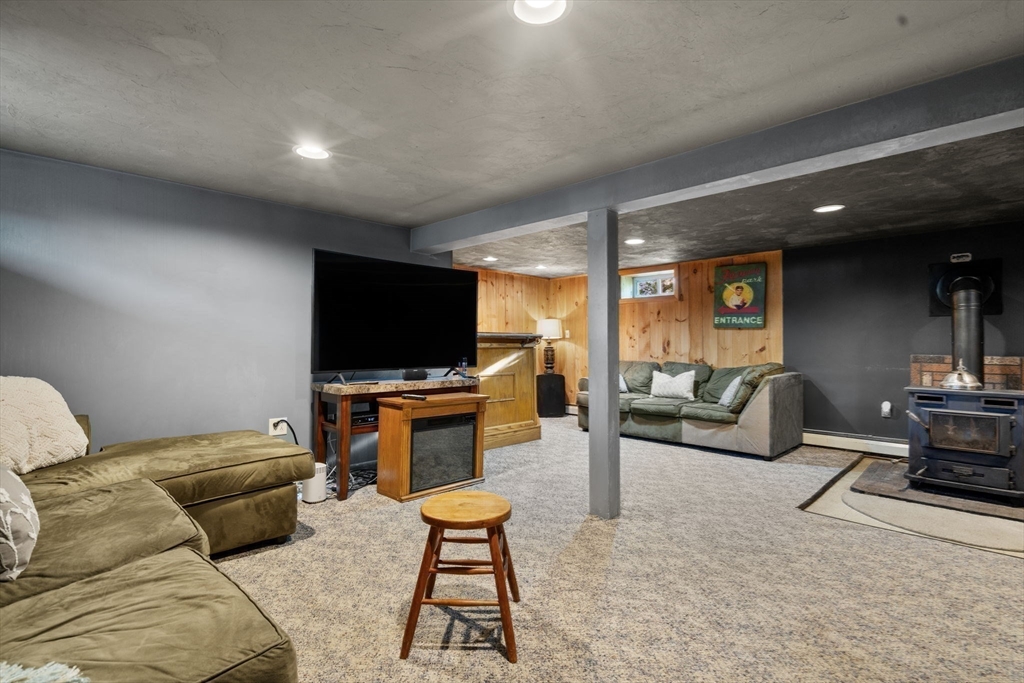 30 Wampum Avenue Waltham, MA 02451 - Photo 13 of 29 a living room with furniture and a flat screen tv