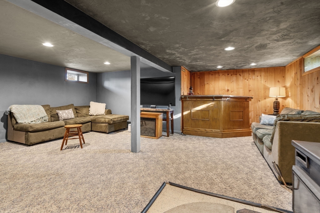 30 Wampum Avenue Waltham, MA 02451 - Photo 14 of 29 a living room with furniture and a flat screen tv